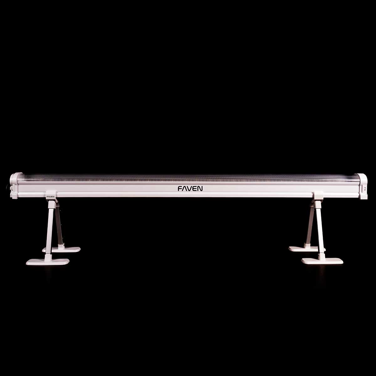 A Faven Under Canopy LED light on stands in front of a black background.