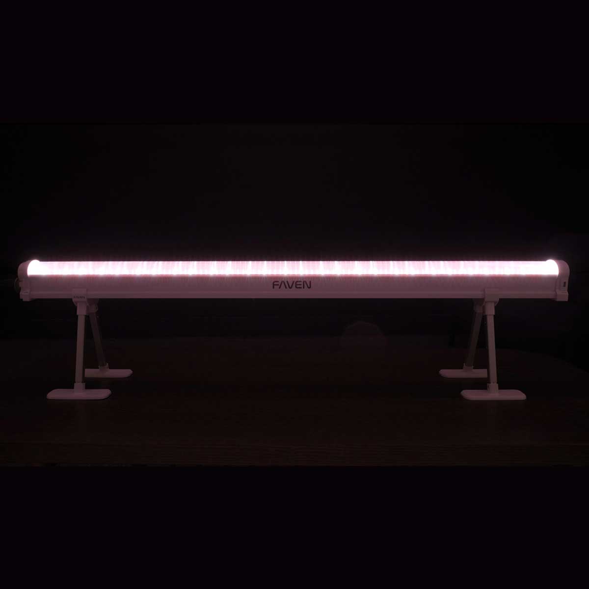 A Faven LED under canopy light shown here with turned on a red spectrum setting in front of a black background.