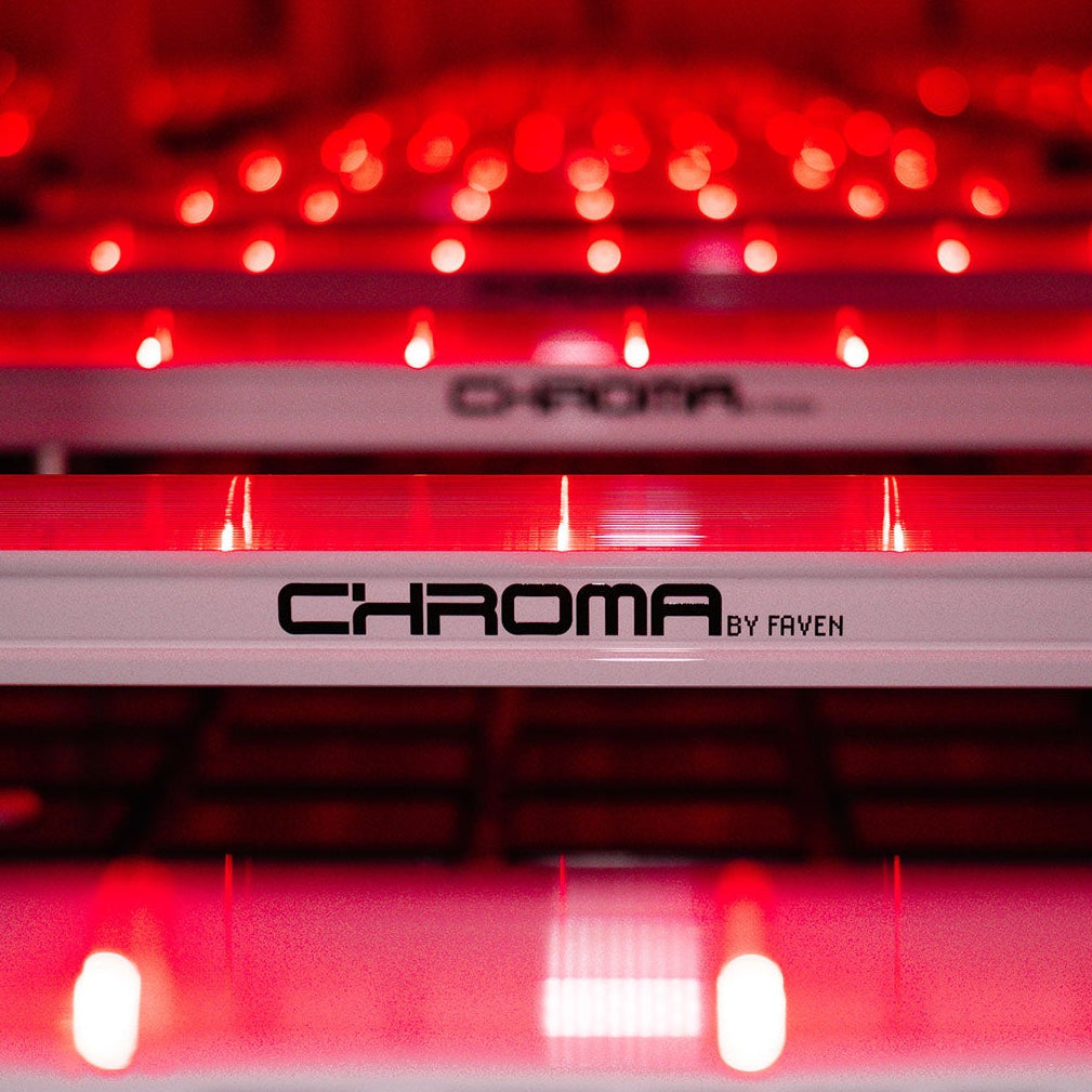 A row of Faven Chroma under canopy lights set to far red lined up in a grow room with no plants. 